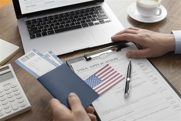 visa-application-composition-with-american-flag_23-2149117758